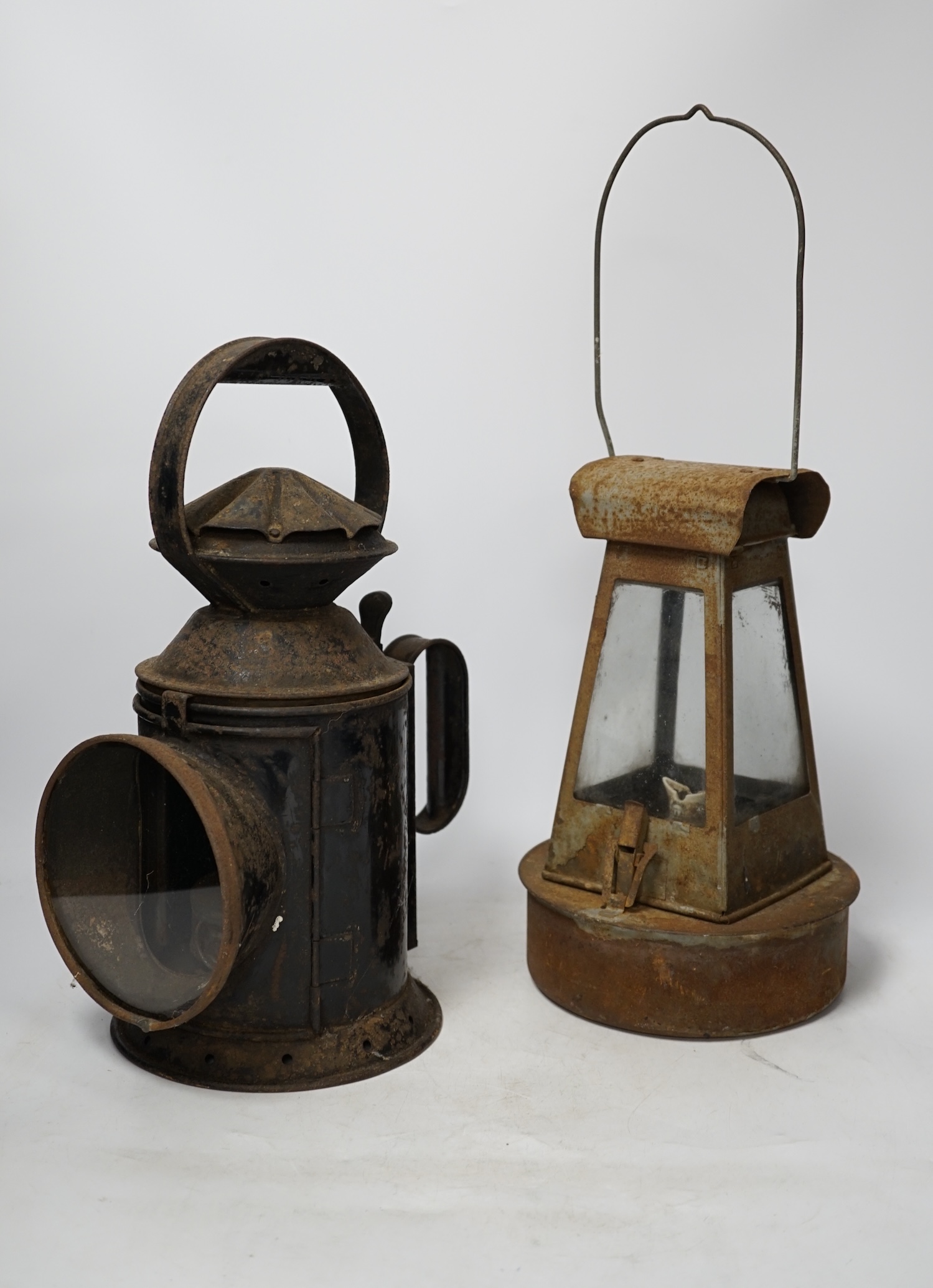 Two late 19th / early 20th century Sherwoods railway lamps, largest 34cm high. Condition - fair, rust and wear to both